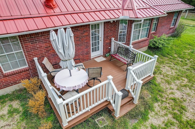 wooden terrace with a yard