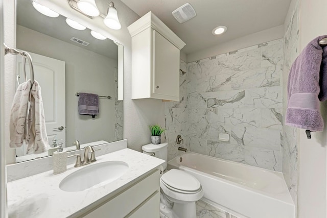 full bathroom with tile patterned flooring, toilet, vanity, and tiled shower / bath