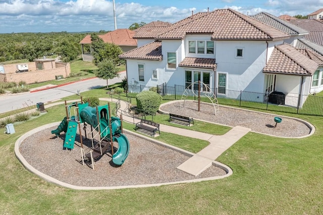 exterior space featuring a playground and a lawn