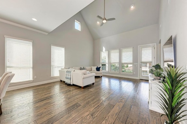 living room featuring ceiling fan, dark hardwood / wood-style floors, and high vaulted ceiling