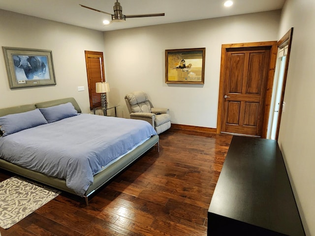 bedroom featuring ceiling fan and dark hardwood / wood-style floors