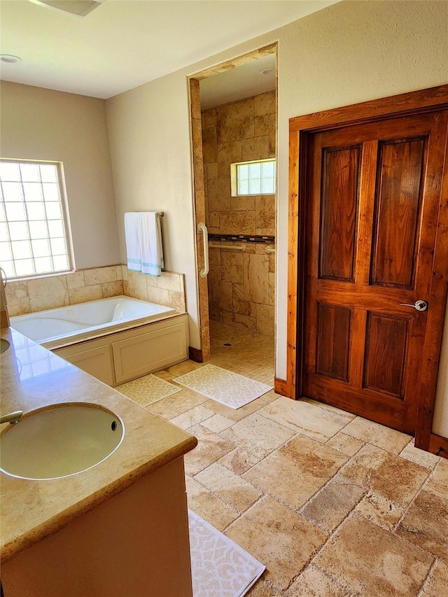 bathroom featuring vanity and separate shower and tub