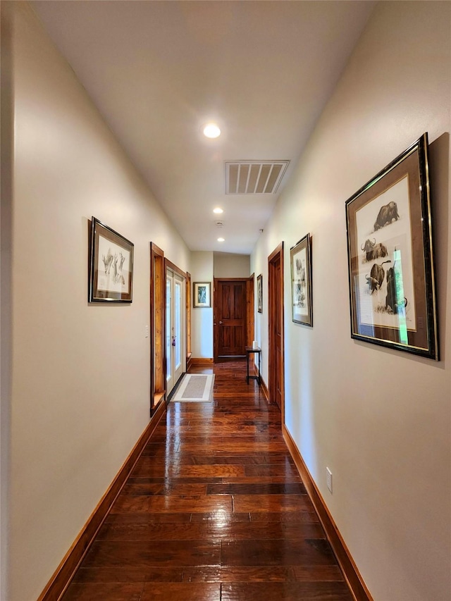 corridor featuring dark hardwood / wood-style floors