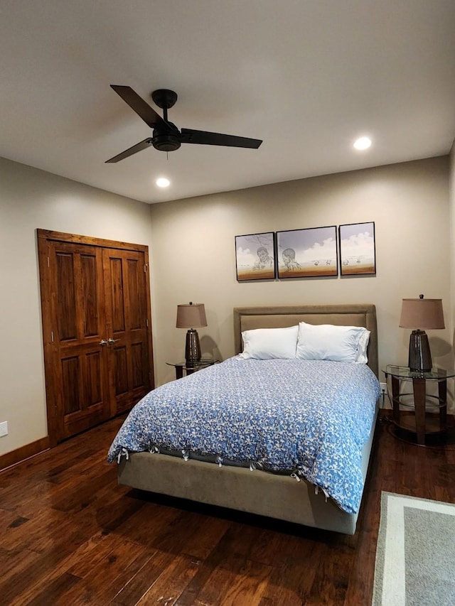 bedroom with ceiling fan and dark hardwood / wood-style flooring