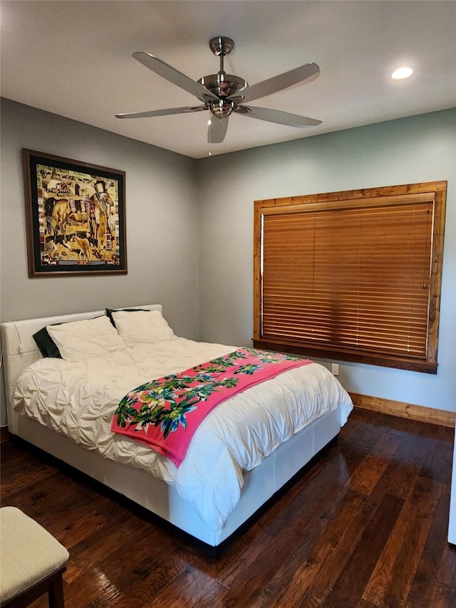 bedroom with ceiling fan and wood-type flooring