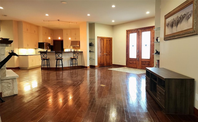 foyer entrance with dark hardwood / wood-style flooring and french doors