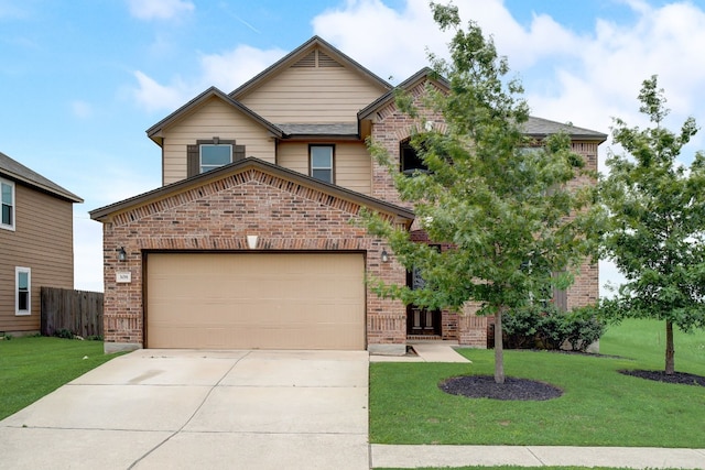 view of front of house with a front yard and a garage