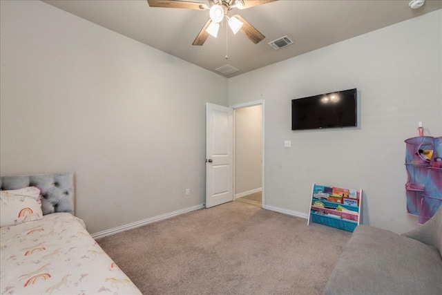 bedroom with ceiling fan and light colored carpet