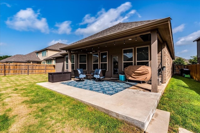 rear view of property with a lawn, an outdoor hangout area, and a patio