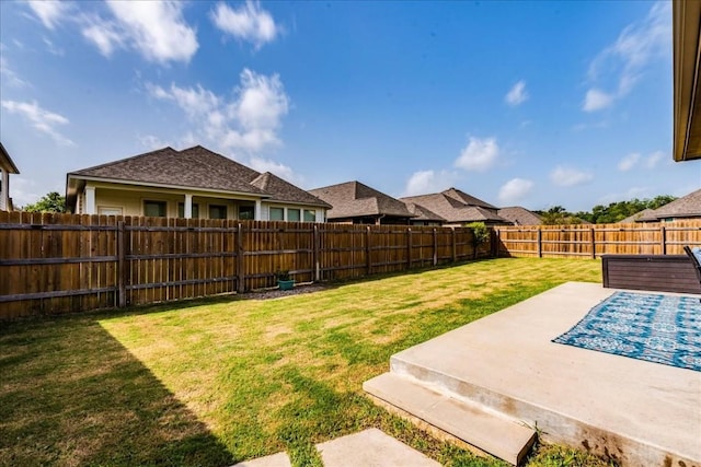 view of yard with a fenced backyard and a patio