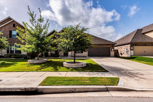 view of front of house with an attached garage, brick siding, driveway, and a front lawn