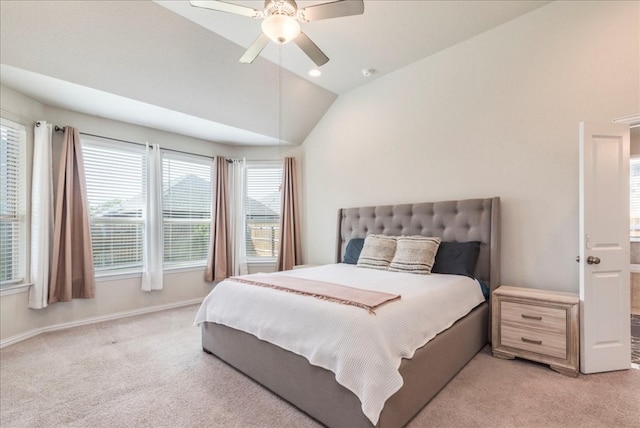 carpeted bedroom featuring vaulted ceiling and ceiling fan