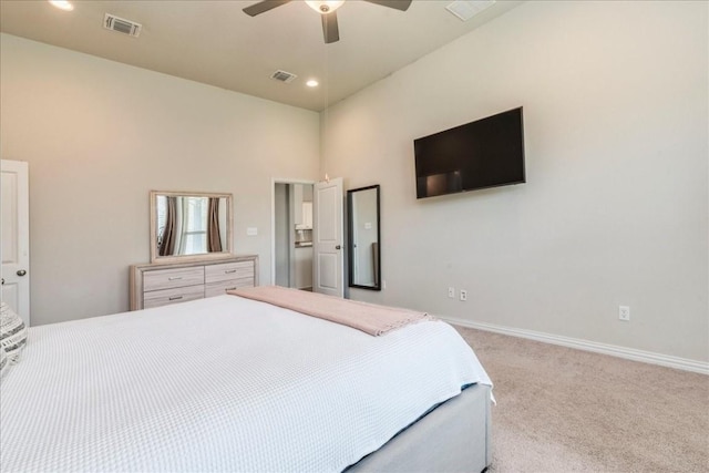 bedroom with carpet floors, visible vents, a towering ceiling, and baseboards