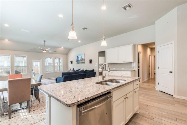 kitchen with dishwasher, sink, ceiling fan, an island with sink, and white cabinetry