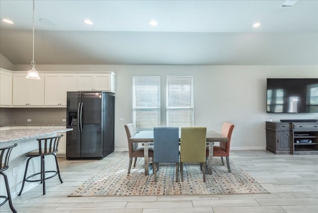 dining room featuring wood finish floors, visible vents, baseboards, and recessed lighting