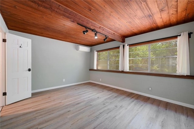 2108 River Hills Rd, Austin, TX 78733 - spare room with a wall mounted AC, wooden ceiling, wood finished floors, and rail lighting
