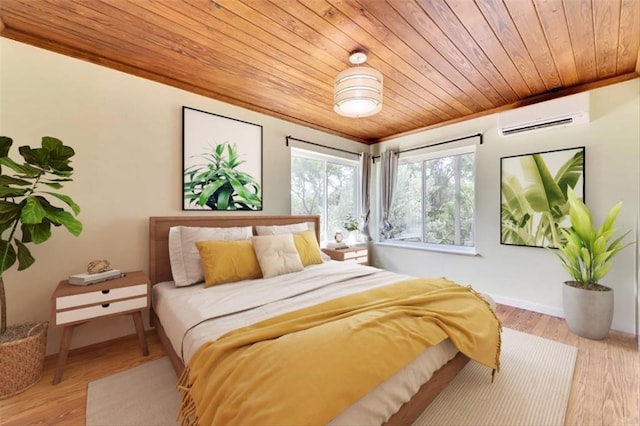 2108 River Hills Rd, Austin, TX 78733 - bedroom featuring a wall mounted air conditioner, wood ceiling, and wood finished floors