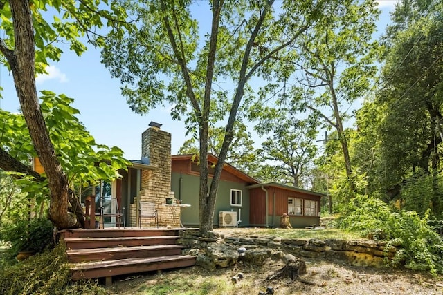 2108 River Hills Rd, Austin, TX 78733 - back of house featuring a chimney and a wooden deck