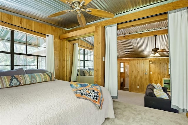2108 River Hills Rd, Austin, TX 78733 - carpeted bedroom with wooden walls and access to exterior