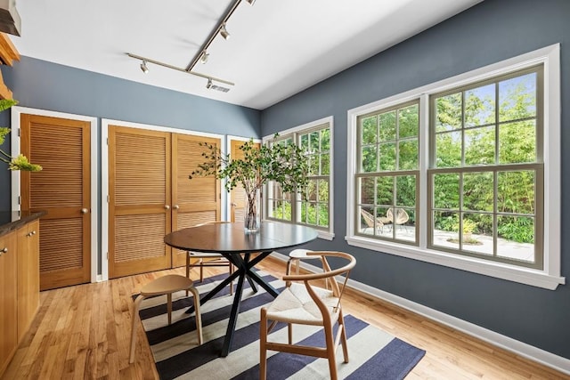 1202 E 30th St, Austin, TX 78722 - dining room with visible vents, baseboards, and light wood-style floors