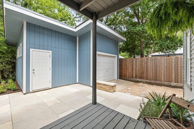 1202 E 30th St, Austin, TX 78722 - view of patio featuring fence and a garage