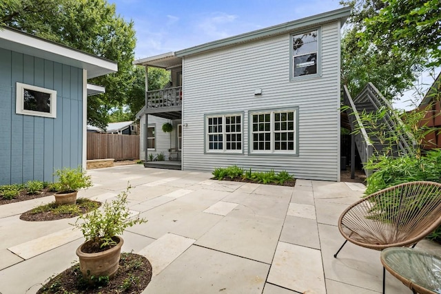1202 E 30th St, Austin, TX 78722 - rear view of house featuring a patio, a balcony, and fence