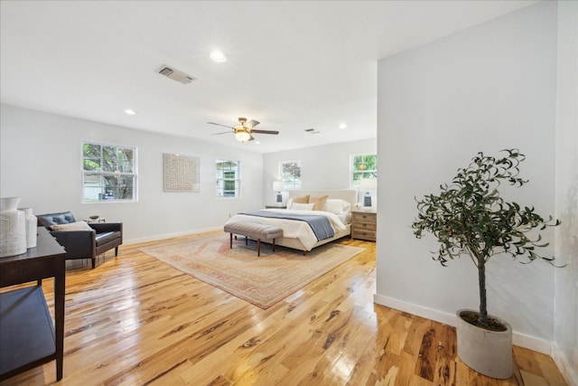 bedroom featuring light hardwood / wood-style floors and ceiling fan