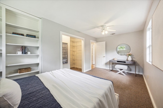 carpeted bedroom featuring ensuite bath and ceiling fan