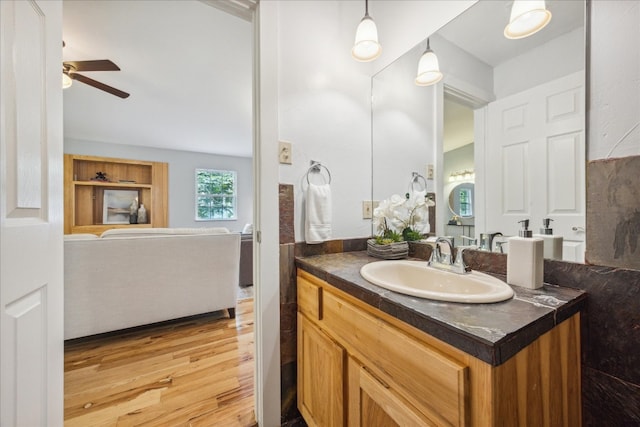 bathroom with vanity, ceiling fan, and hardwood / wood-style flooring