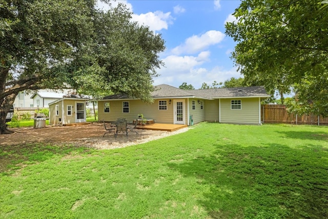 back of house with a yard