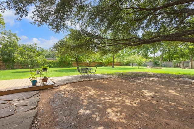 view of yard with a wooden deck