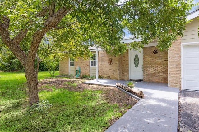 obstructed view of property with a garage and a front yard