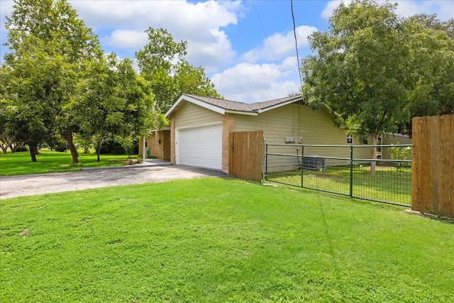 exterior space featuring a garage and a yard