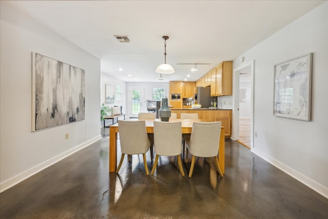 dining space with rail lighting