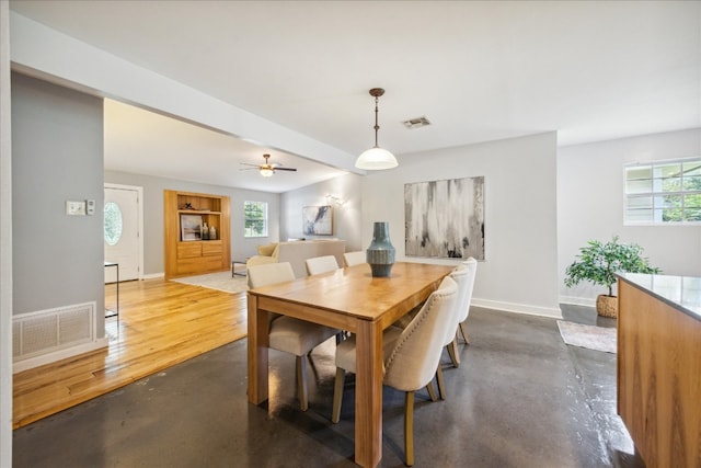 dining space featuring ceiling fan