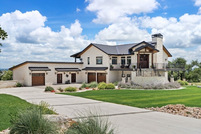 view of front of property featuring a garage and a front yard