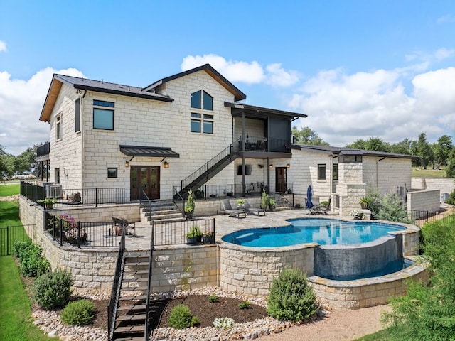 view of pool featuring a patio and a hot tub