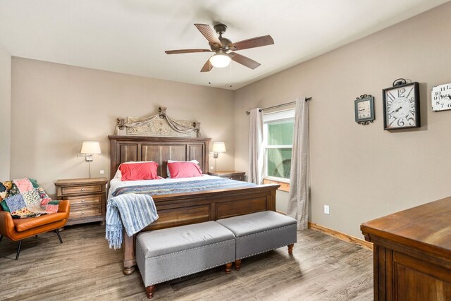 bedroom featuring hardwood / wood-style flooring and ceiling fan