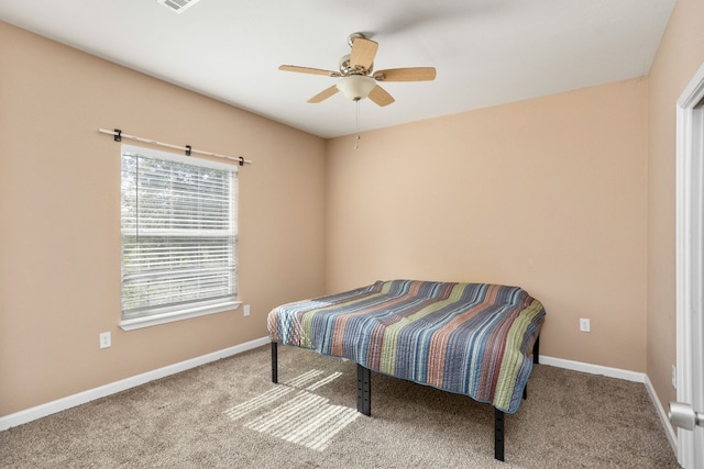 bedroom featuring ceiling fan, carpet, visible vents, and baseboards