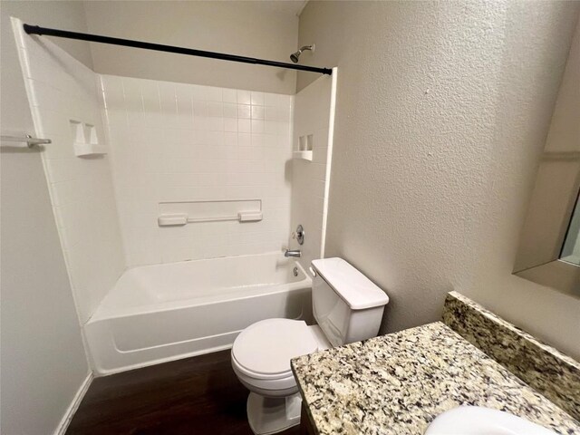 full bathroom featuring shower / tub combination, wood-type flooring, vanity, and toilet