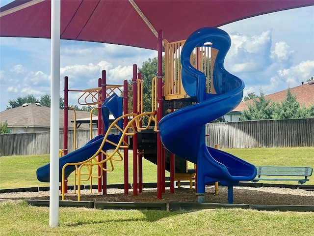 view of jungle gym with a lawn