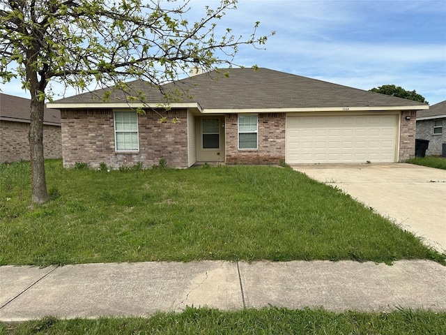 ranch-style house with a garage and a front yard