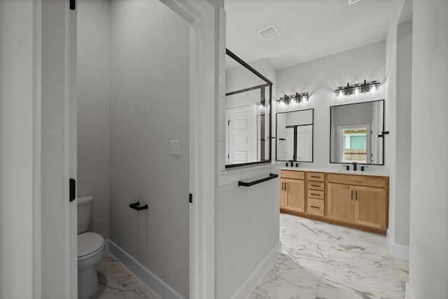 bathroom with vanity and toilet