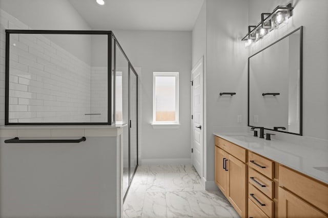 bathroom with vanity and a shower with shower door