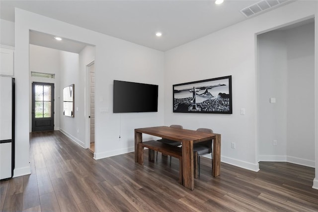 dining area featuring dark hardwood / wood-style flooring