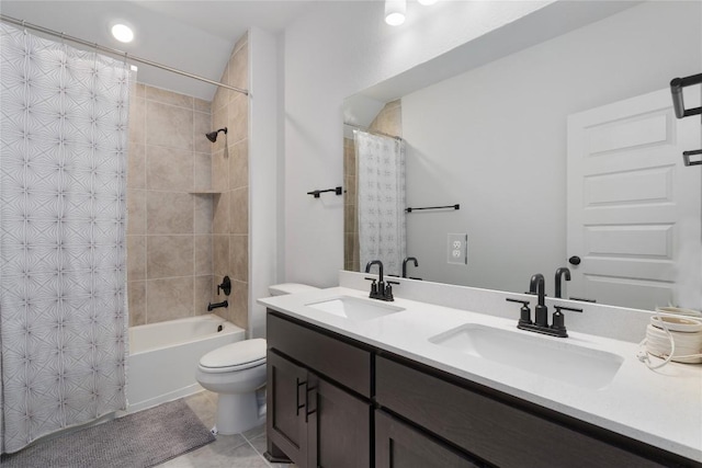 full bathroom featuring tile patterned floors, vanity, toilet, and shower / bath combo