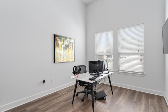 office area with baseboards and wood finished floors