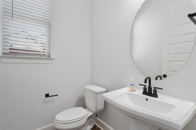 bathroom featuring sink and toilet