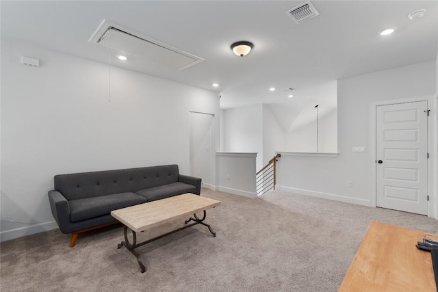 living area featuring carpet, recessed lighting, visible vents, attic access, and an upstairs landing