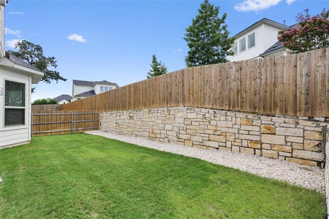 view of yard with a fenced backyard